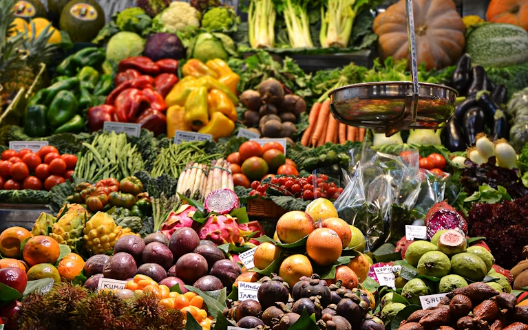 Colourful assortment of fresh tropical fruits and market produce